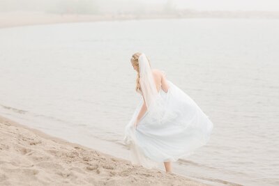 bride-taking-a-walk-along-the-beach