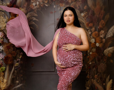 pregnant wearing pink gown