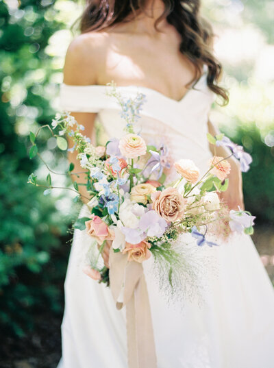 Bride With Peach, Lilac and Pink Floral Bouquet