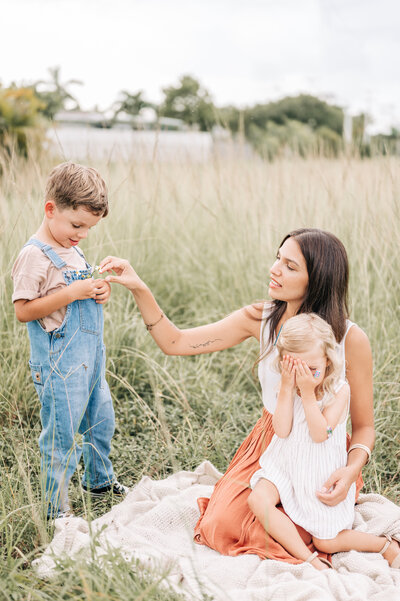 South Florida Family Photographer captures family hanging out on the field