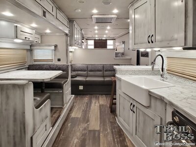 View of a couch inside a luxury horse trailer conversion 