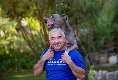 Cesar Millan posing with his dog Junior Training Cesars Way Workshop in Santa Clarita CA