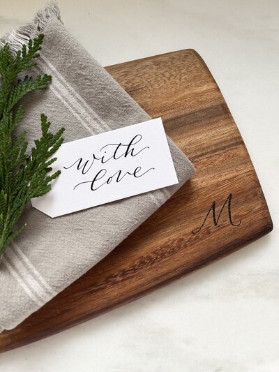 Cutting board with wood burned calligraphy monogrammed letter M