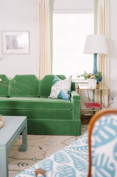 green sofa in a colorful parlor room