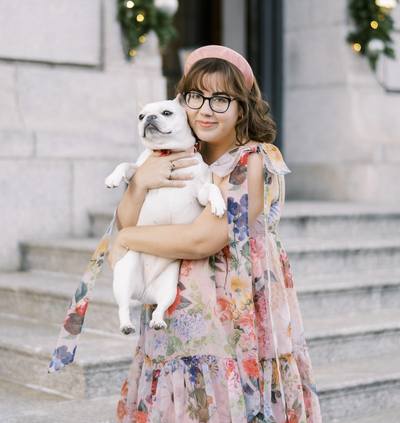 An NYC Wedding Photographer holding her dog.