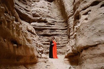 Couple embraces inside of a Anza Borrego slot canyon