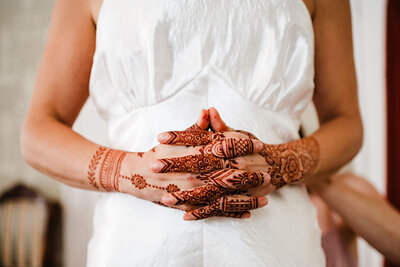 Close up of bride's hands with henna on them, Blended wedding at Peirce Farm at Witch Hill