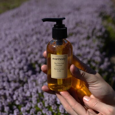Person using a dropper to apply Primally Pure Beard Oil