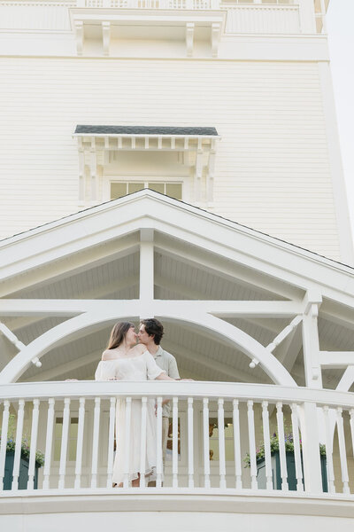 couple standing on balcony on Boardwalk in Michigan