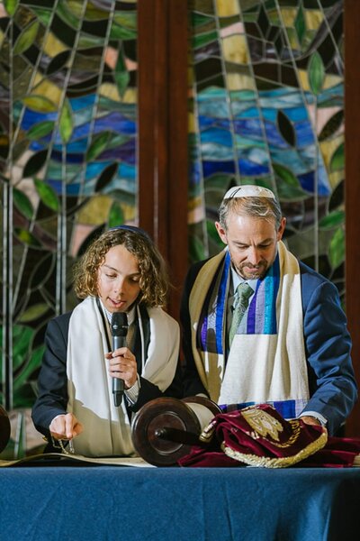 Boy and Rabbi during reading Bar Mitzvah at Tahoe vista temple