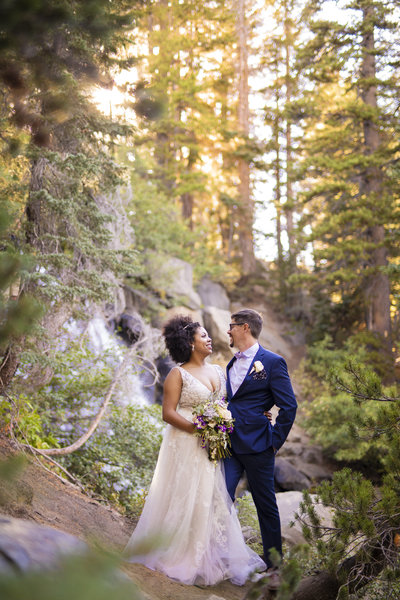 Wedding Photography, bride and groom next to waterfall
