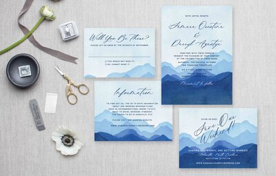 Blue watercolor mountain painted invitation suite