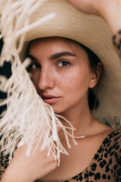 photo-of-woman-wearing-straw-hat-3597105