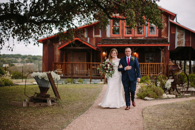 father and daughter walking down the aisle for an outdoor wedding near San Antonio
