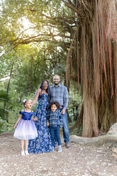 family portrait at san francisco botanical gardens in spring, blue outfits, outdoor portraits, laughing and smiling, photo by Anastasiya Photography - San Francisco Photographer