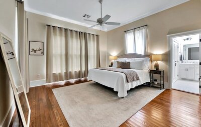 Bright and airy master bedroom  in this 3-bedroom, 2-bathroom vacation rental home near the Silos and Baylor in Waco, TX