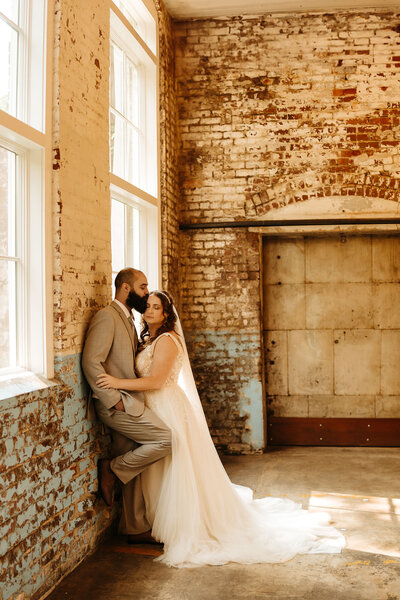 bride and groom standing together in ceremony area