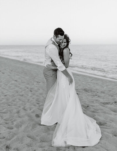 bride and groom together on a beach