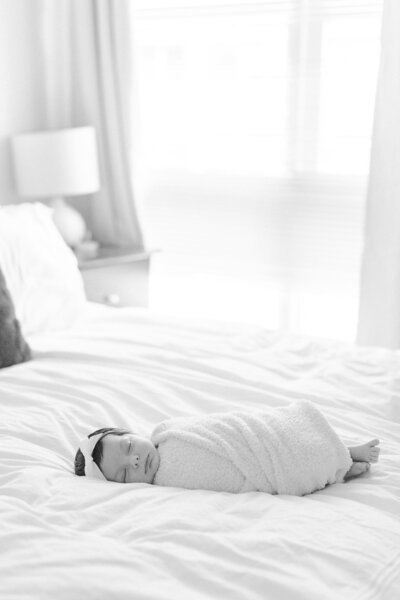 Newborn baby swaddled on the bed in washington dc