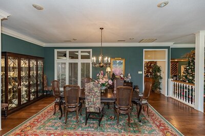 Formal dining room with green walls in Lakeridge division, Lubbock TX