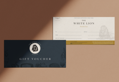 Flatlay image of pub vouchers designed by TLPS