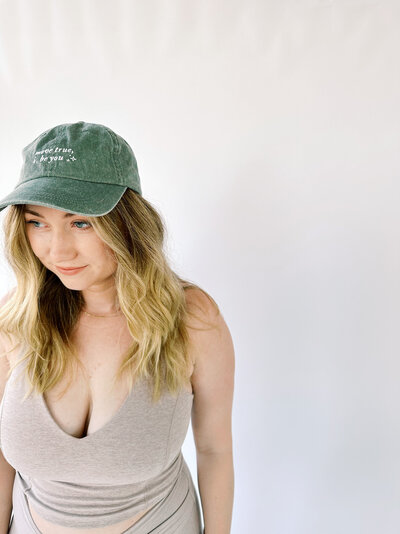 Woman wearing a green True40 cap