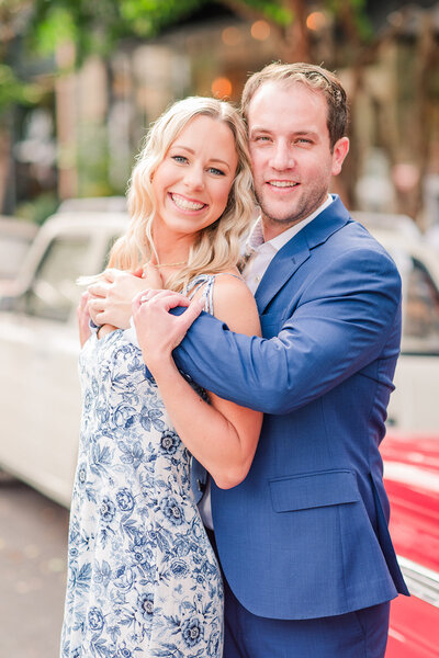 bride and groom smiling at each other while holding hands