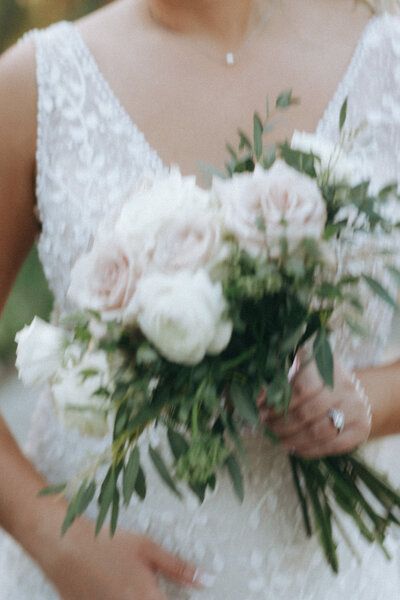 Bride holding bouquet on wedding day