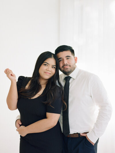 Donna and Matthew Photography during their headshot photos with their camera in an all white studio indoors