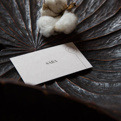 Brown natural elegant wedding place card namecard sitting in dark brown bowl
