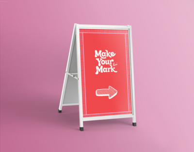 A-frame signage with custom lettering on a pink background designed by Amanda Burg