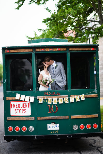 Couple kisses on streetcar at Meridian MS Wedding at Union Station