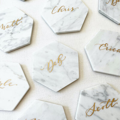 marble tile places cards  with gold ink calligraphy