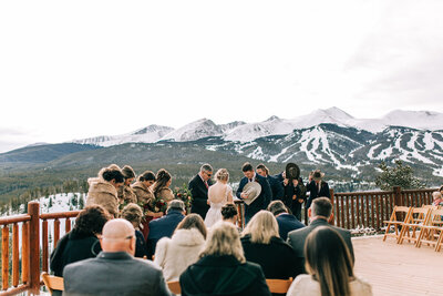 winter outdoor wedding ceremony with mountain view