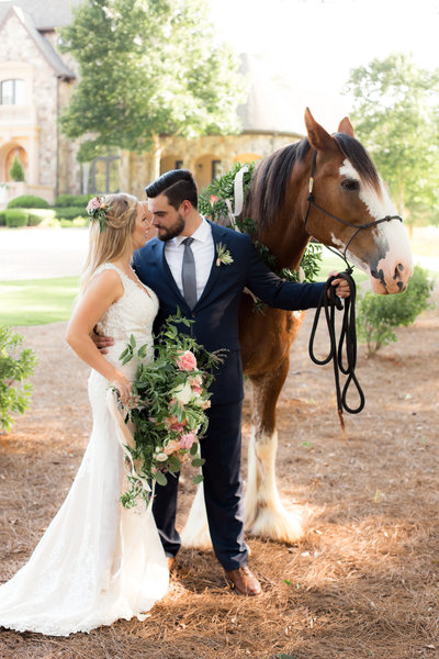 Atlanta Wedding Couple  Stands next to horse for photographer