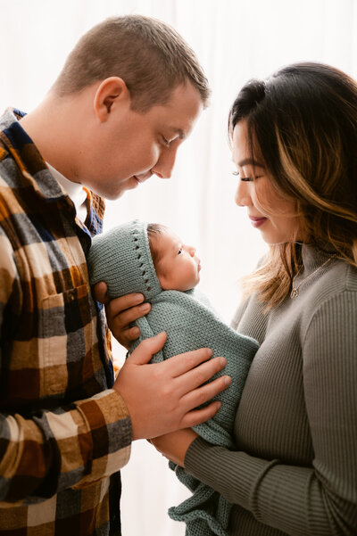 super sweet newborn family portraits in studio in Princeton Minnesota