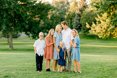 Family Hugging in Grass in Rexburg Idaho