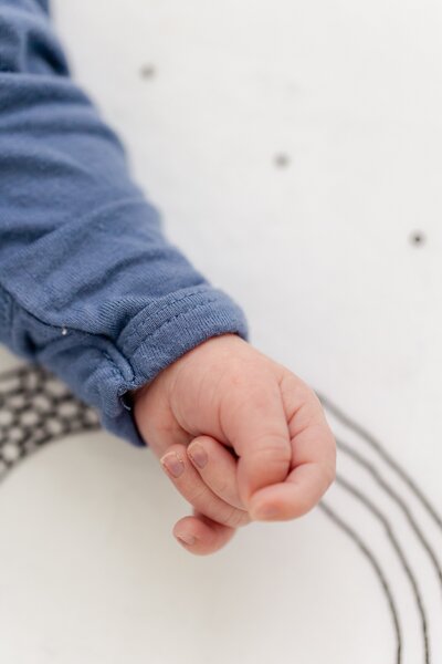 close-up of newborn baby's hand showing tiny fingers