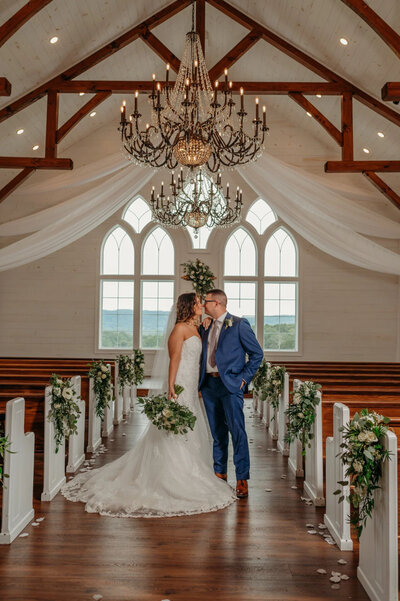 photo of bride and groom  inside Howe Farms chapel