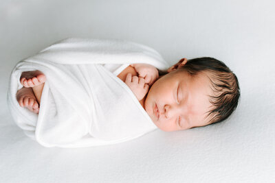 Newborn portrait, newborn wrapped in blanket