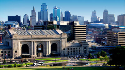 The Modern Day rebuilt Union Station with the Kansas City Skyline behind it.