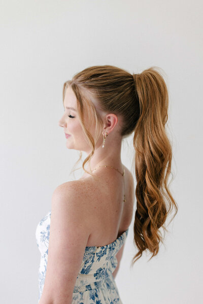 Final touch-up for the UpTown blowout at SoCo Blow Dry Bar to ensure flawless finish and long-lasting shape