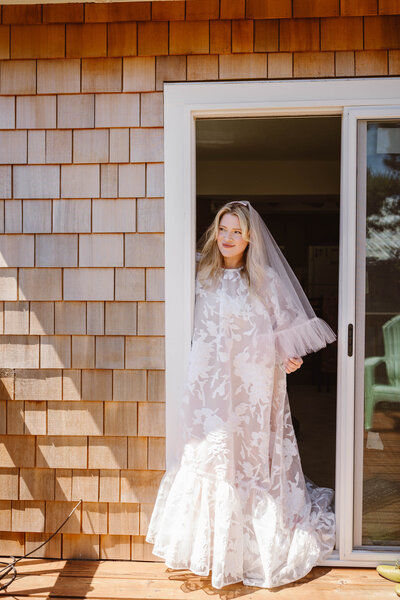 wedding dress hanging on a porch