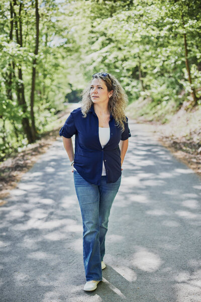 Sarka walking on a  path in the forest