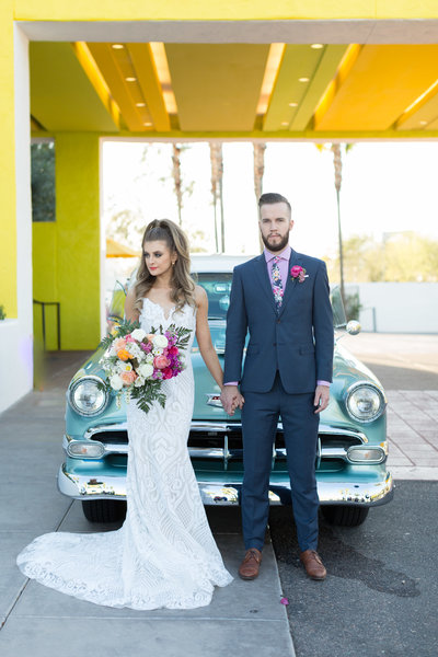 bride and groom colorful vintage car