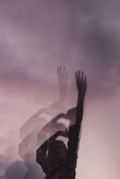 woman dancing with dusk sky, freedom, liberation, confidence