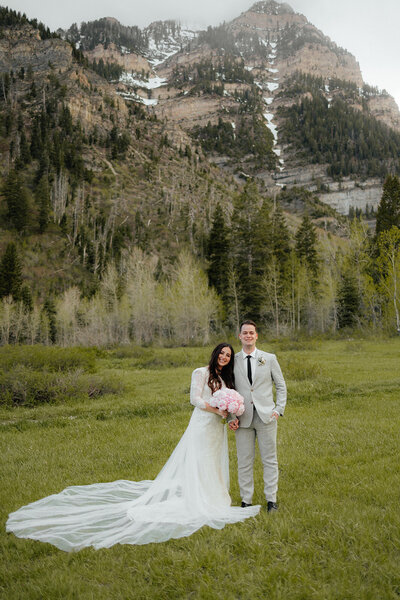 Utah spring mountain bridal shoot with couple in wedding dress with blush peony bouquet.