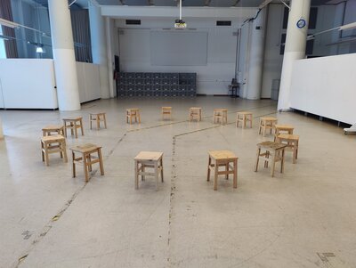 A circle of little empty  chairs
