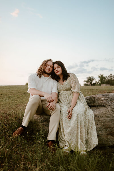 couple sitting together in grassy area