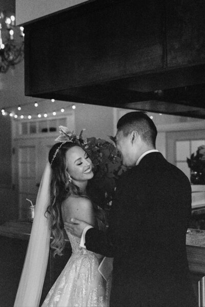 A photo of a couple at their wedding reception in black and white 35mm film by Florida wedding photographer Angelika Krug Photo & Film